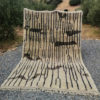 Taupe moroccan wool rug with black design