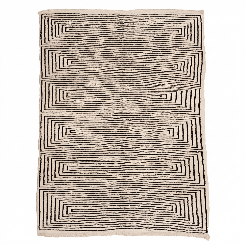 Striped Moroccan rug with black and white geometric labyrinth pattern, hand-woven natural wool Berber carpet