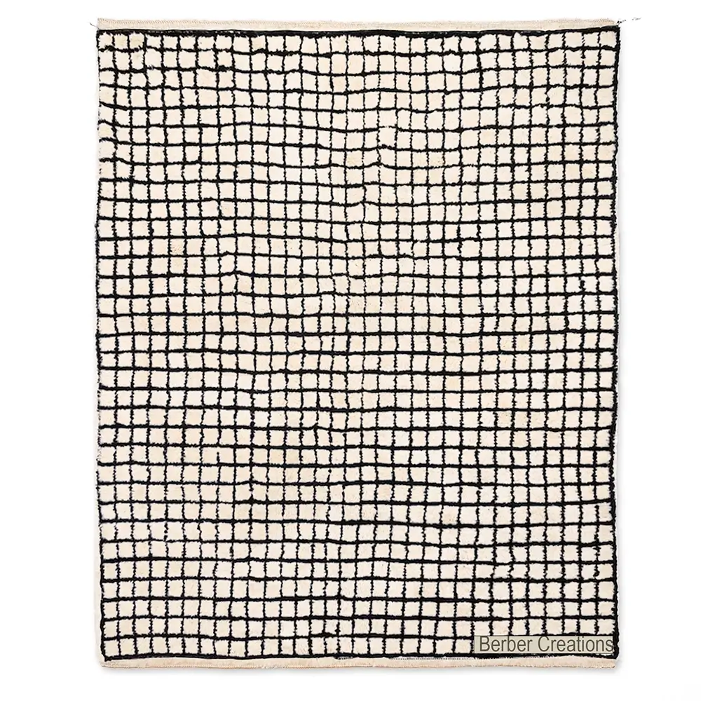 Handcrafted Moroccan Berber rug with a black geometric grid pattern on a natural white wool background