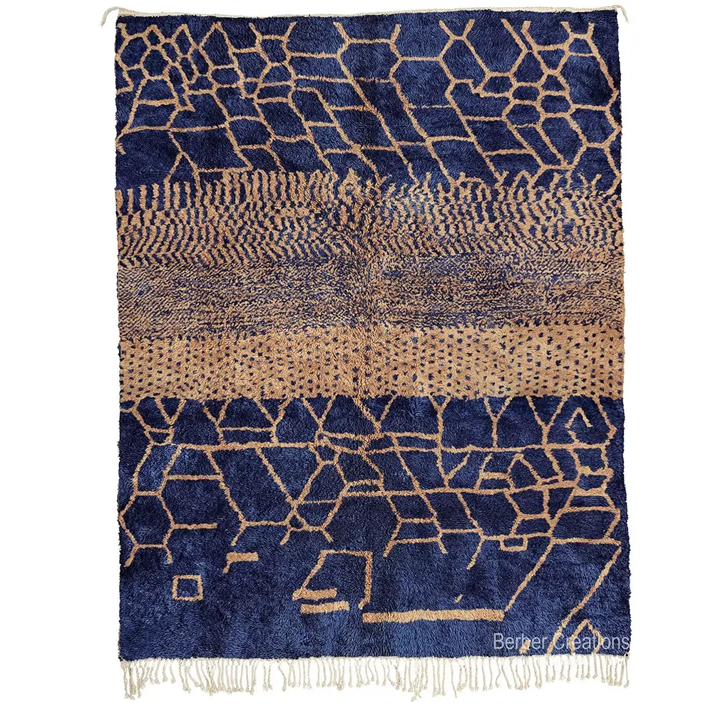 Handcrafted Moroccan Berber rug with a unique, segmented abstract pattern in blue and beige