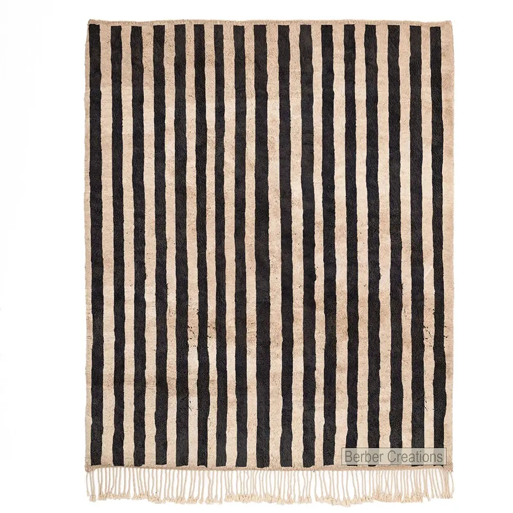 Hand-woven Moroccan wool rug with bold black and white vertical stripes (1)