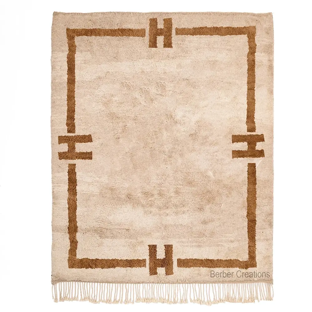 Moroccan Berber Shag Rug with thick, plush beige wool and a bold brown geometric 'H' border design