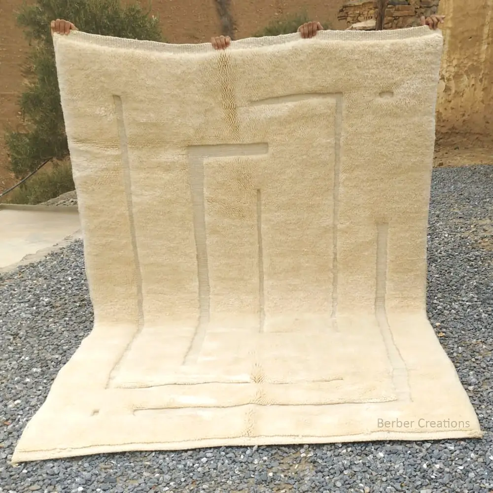 Beni Mrirt handwoven rug, Aurescence. Full view showing the plush, high-pile natural cream wool and the intricate, sculptural geometric line design.