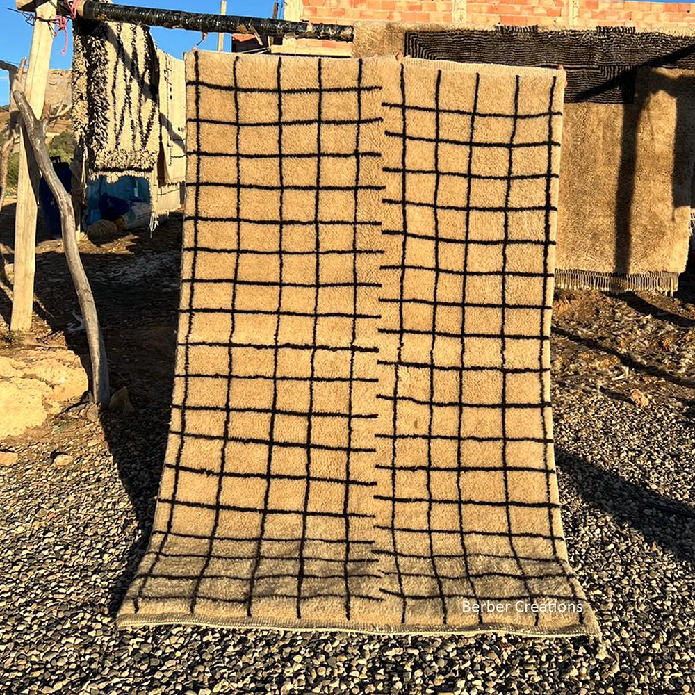 Beige and black Beni M’rirt Moroccan rug with an asymmetric double grid design and a plush, high-density wool pile