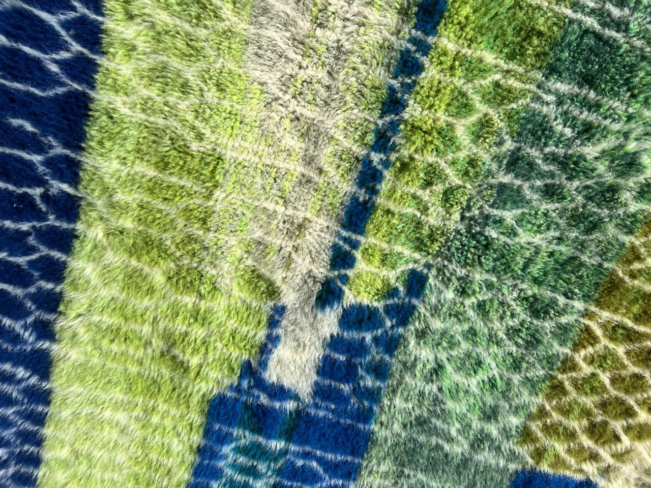 contemporary Moroccan wool rug green, navy blue, and sage details 1