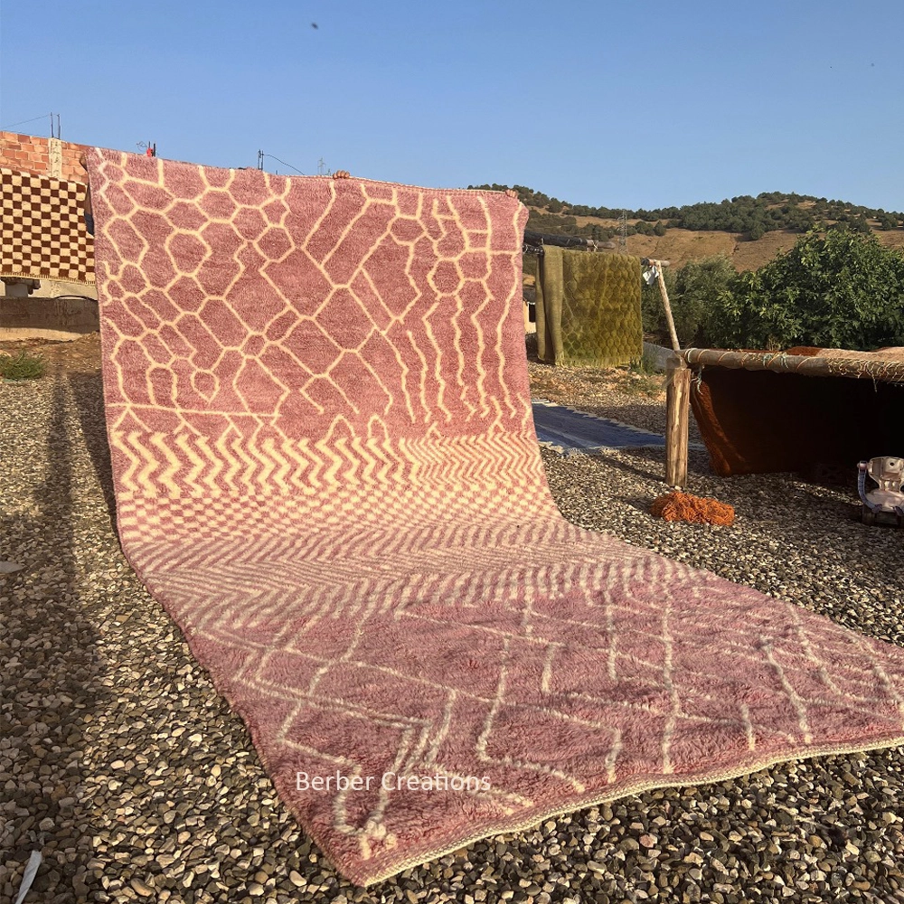 Hand-knotted mauve and cream Moroccan Berber wool rug featuring a unique abstract combination of geometric zig-zags, diamond lattices, and organic cellular patterns