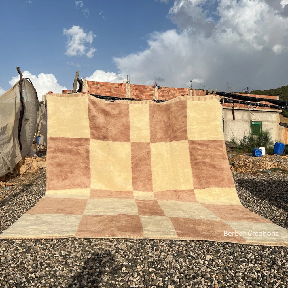 Hand-knotted terra cotta and cream Moroccan Berber wool rug featuring a minimalist large-scale checkerboard pattern and plush texture