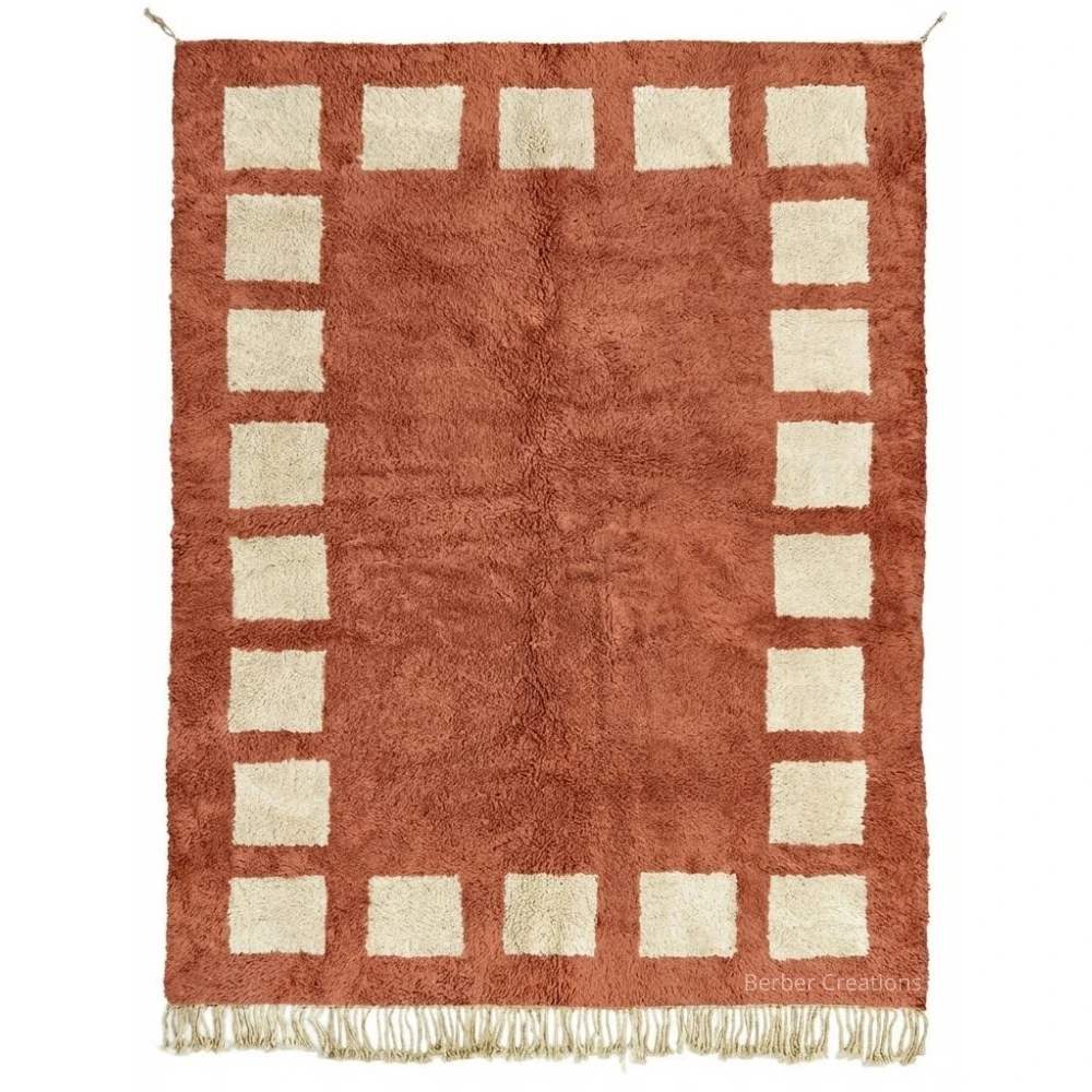 The Crimson Courtyard hand-knotted terracotta and cream Moroccan wool rug with geometric border