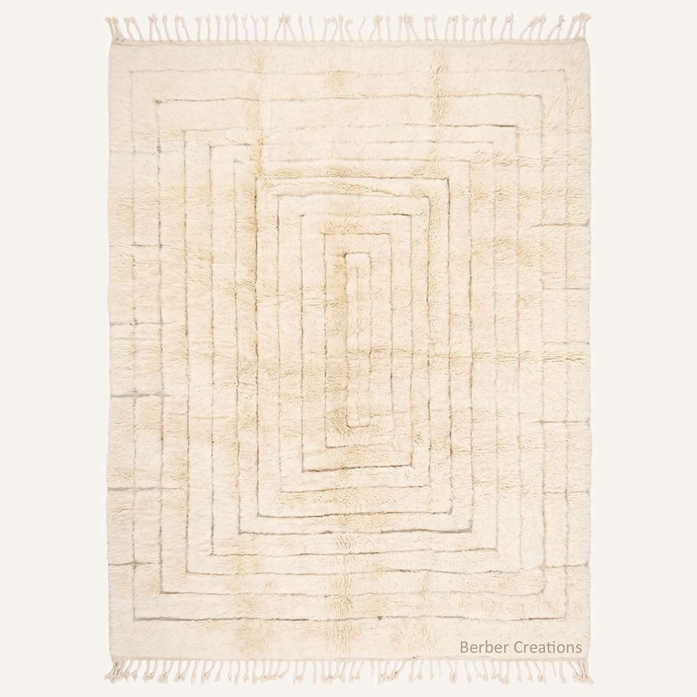 High-pile ivory Beni Mrirt rug with hand-carved concentric rectangle pattern, handmade from organic wool in our Moroccan workshop.