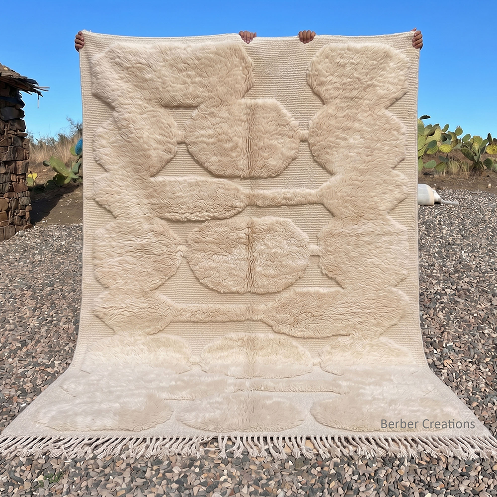 Atlas Petals 3D sculptural Moroccan rug by Berber Creations, featuring organic high-pile ivory wool shapes on a hand-woven flat-weave foundation, available in custom sizes.