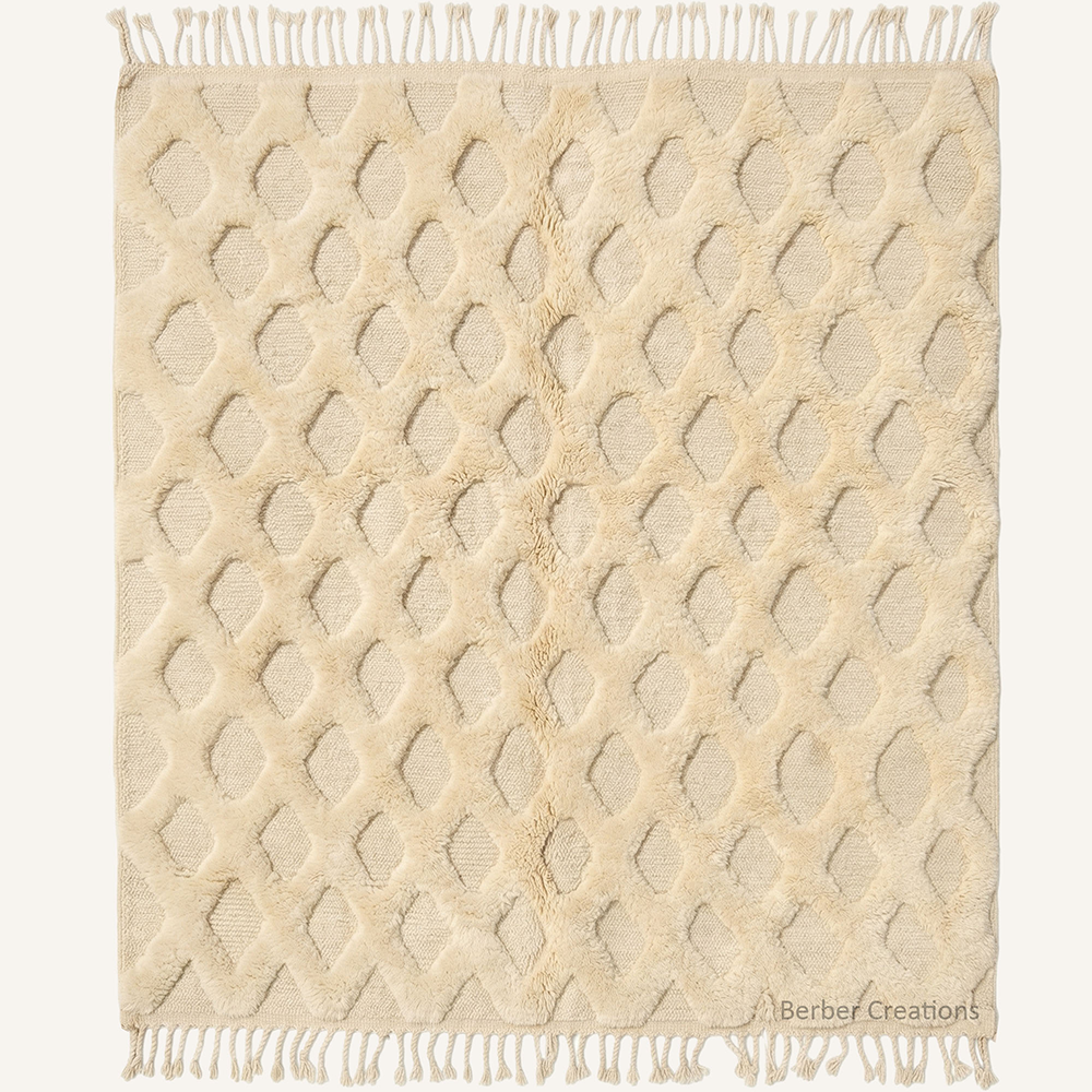 Custom-sized 3D textured diamond Moroccan rug "The Saharan Lattice" by Berber Creations. Features a raised cream wool lattice pattern on a flat-weave base. High-low sculptural texture with braided fringe, made in our Atlas workshop.