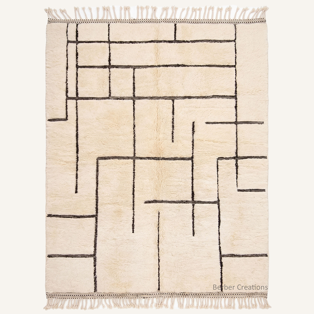 ivory Beni Mrirt rug with minimalist black grid pattern, handmade from organic wool in our Moroccan workshop.