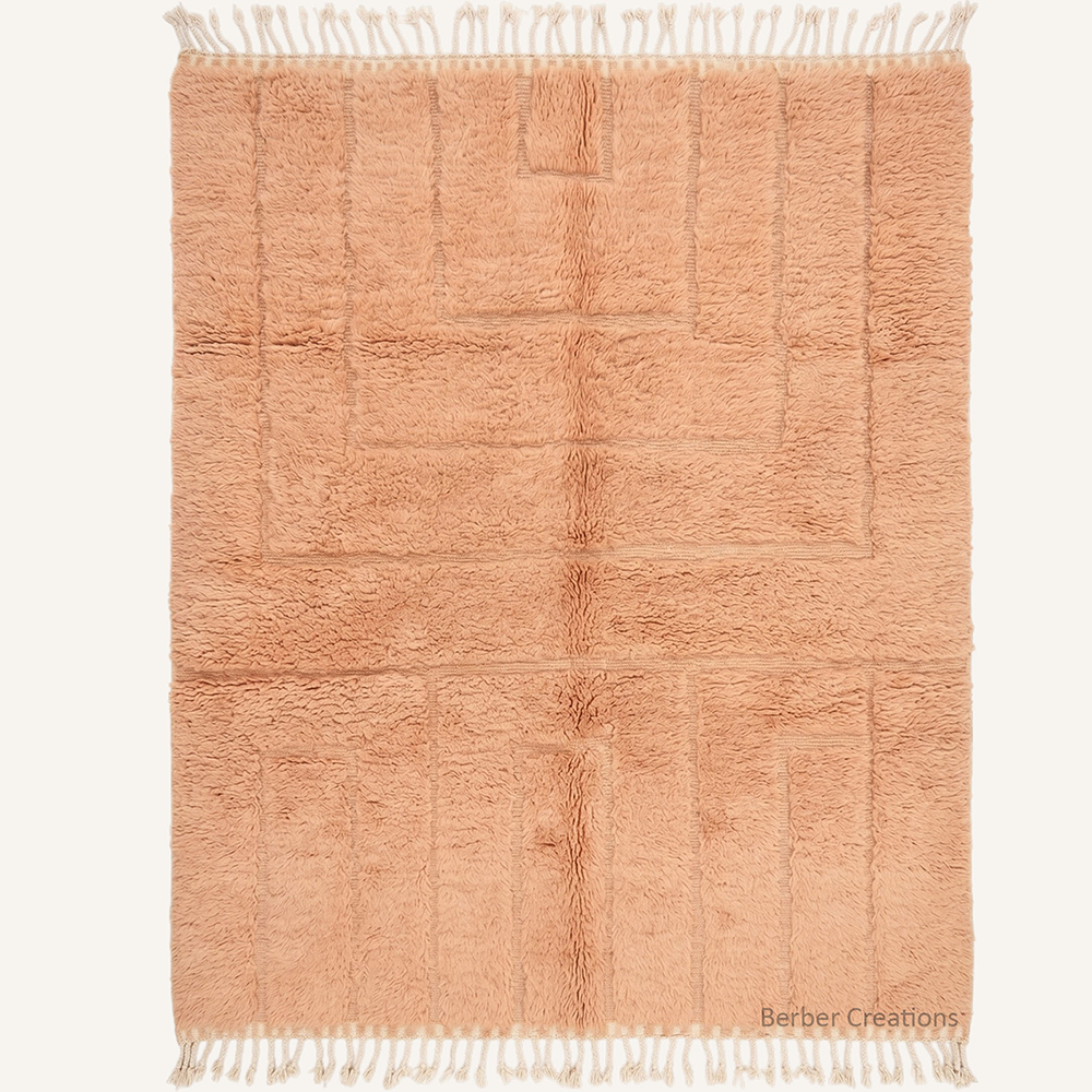 The Ivory Relief 3D linear carved soft peach Moroccan wool rug, hand-knotted in the Berber Creations workshop.