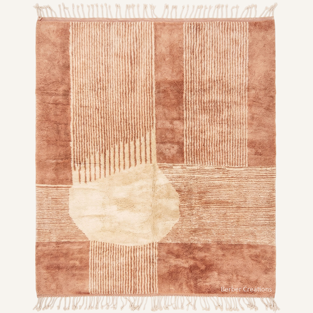 The Anissa 3D abstract linear carved peach and terracotta Moroccan wool rug with an organic cream motif, hand-knotted in the Berber Creations workshop.