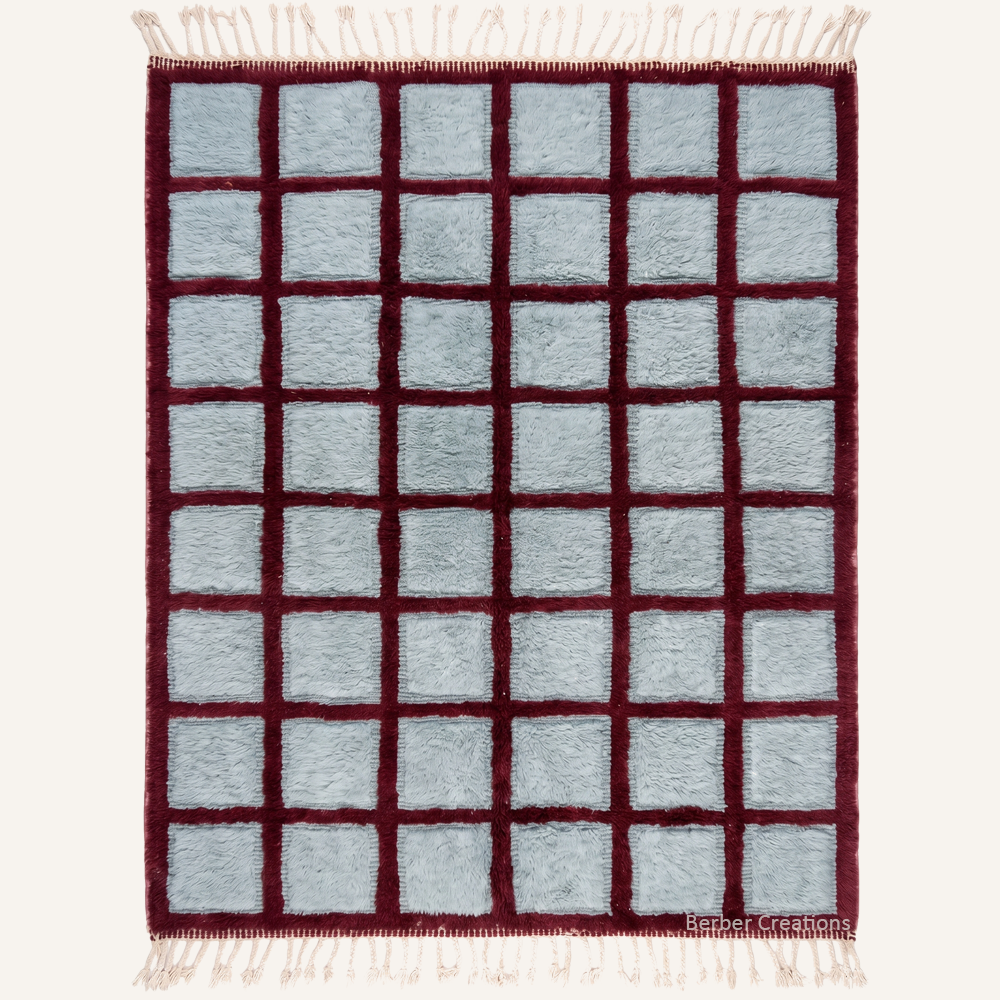Flat-lay view of The Dune Grid authentic sand-toned Moroccan wool rug, featuring a high-low, block-based geometric pattern with an ultra-dense plush pile.