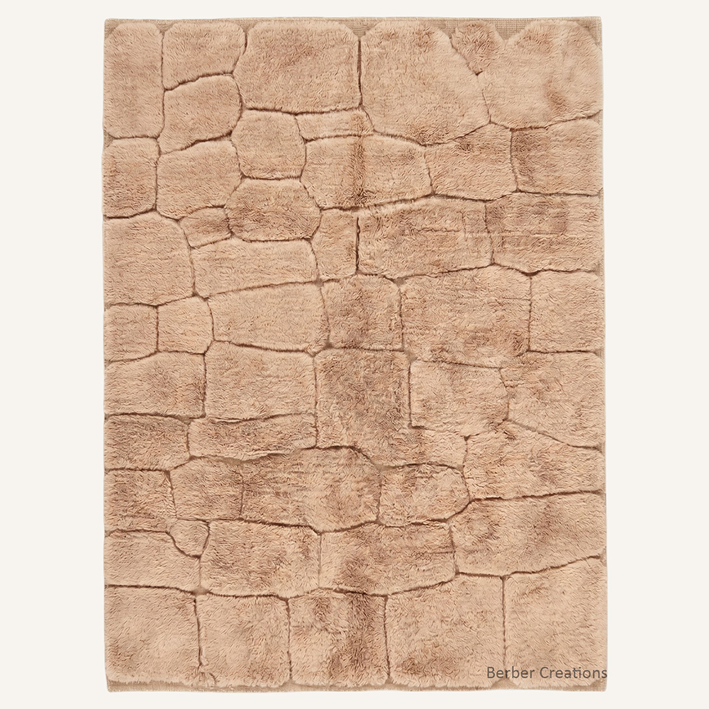 The Earthen Pathway authentic camel-taupe Moroccan wool rug, featuring a dense high-pile texture hand-carved into a 3D cobblestone stone-path pattern