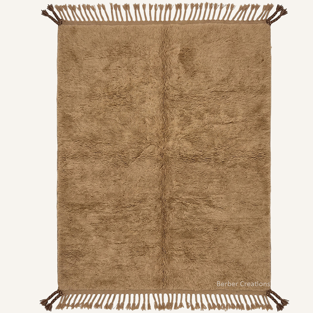 The Sandstone Haven authentic plain golden-khaki Moroccan wool rug, featuring a dense plush pile and detailed dark chocolate brown