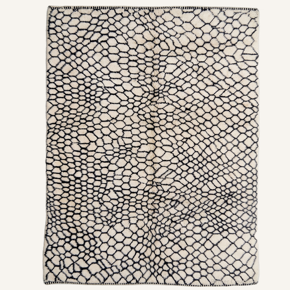 Abstract "Obsidian Net" Moroccan wool rug with plush pile, featuring an organic black honeycomb cellular network on a soft cream background, hand-knotted by Berber Creations.