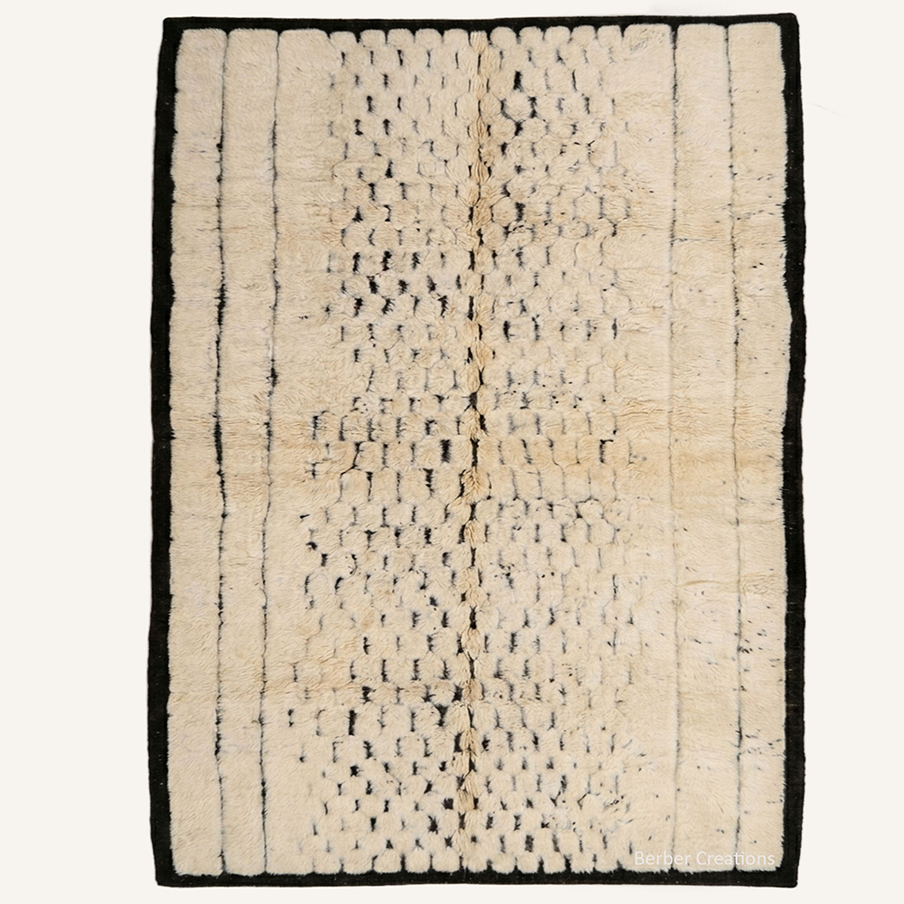 Tribal abstract "Midnight Grid" Moroccan wool rug with cream pile, featuring black honeycomb lattice and vertical line patterns, hand-knotted by Berber Creations.