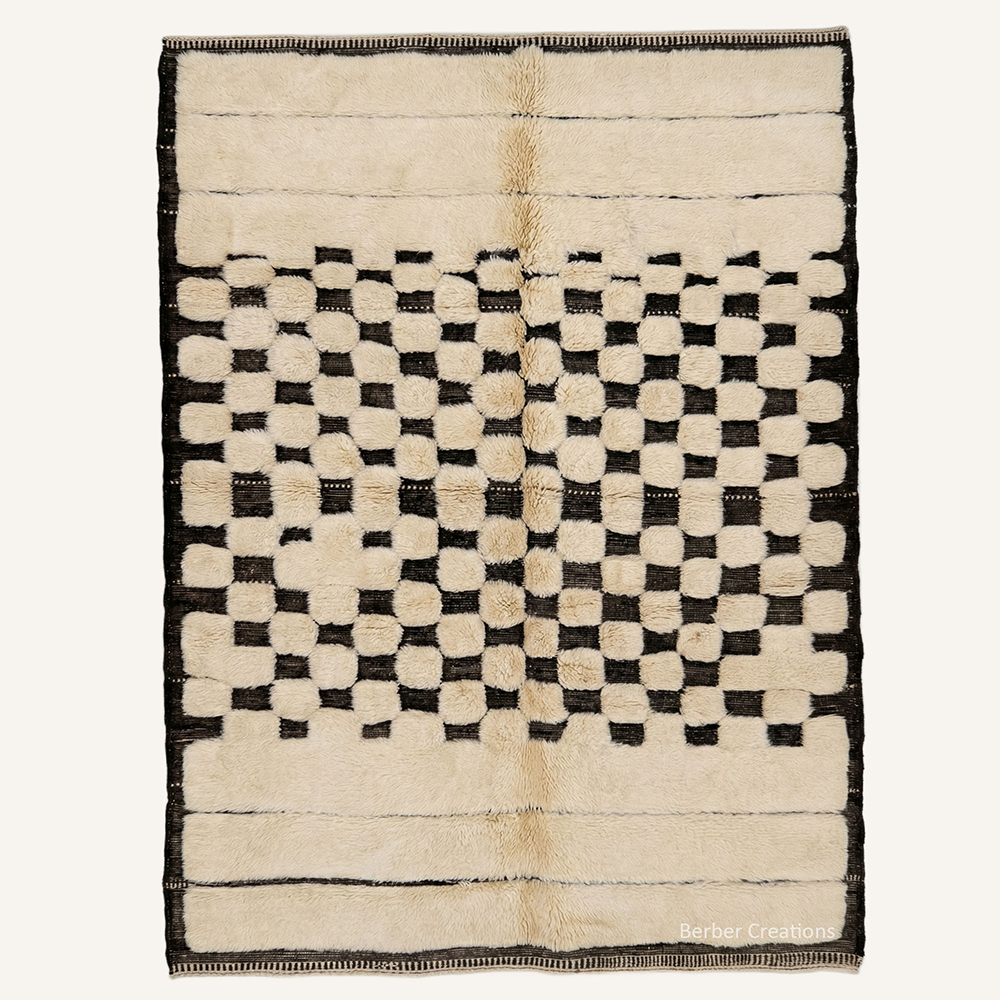 Abstract "Midnight Pixel Checker" Moroccan wool rug with plush pile, featuring a black block checkerboard center and linear borders on a soft cream background, hand-knotted by Berber Creations.