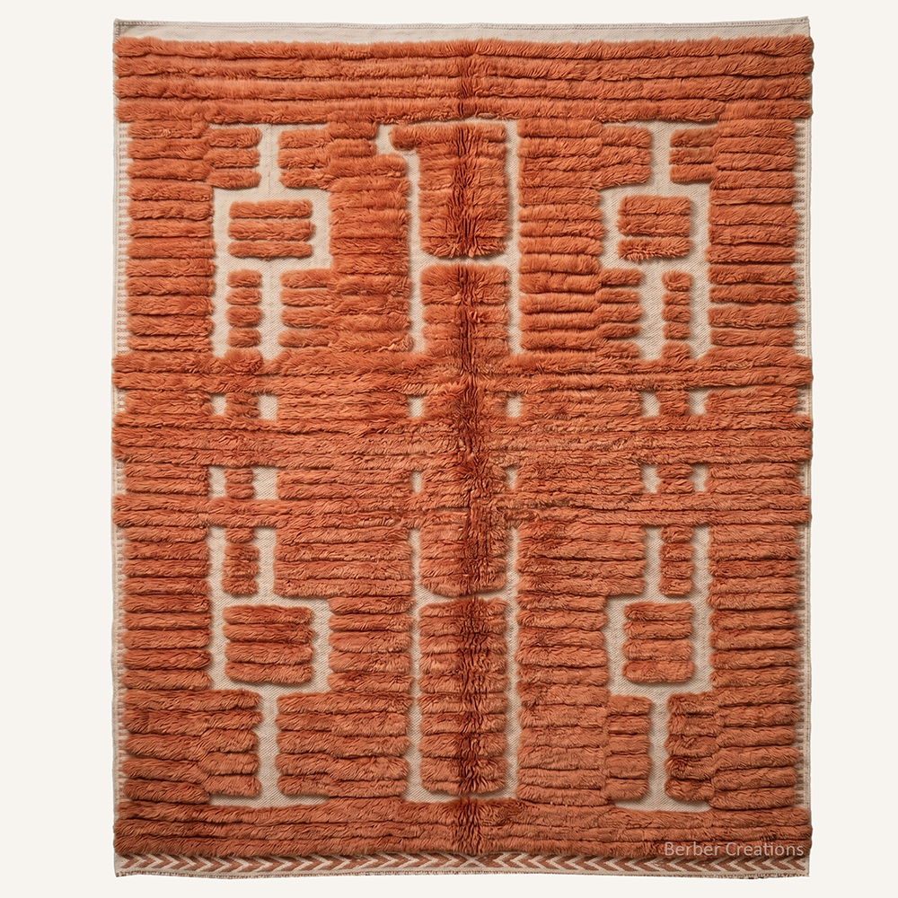 Nadia structural high-pile hand-knotted Beni Mrirt wool rug in Rust Orange with a complex linear ribbed symmetrical pattern, crafted in the Berber Creations workshop.
