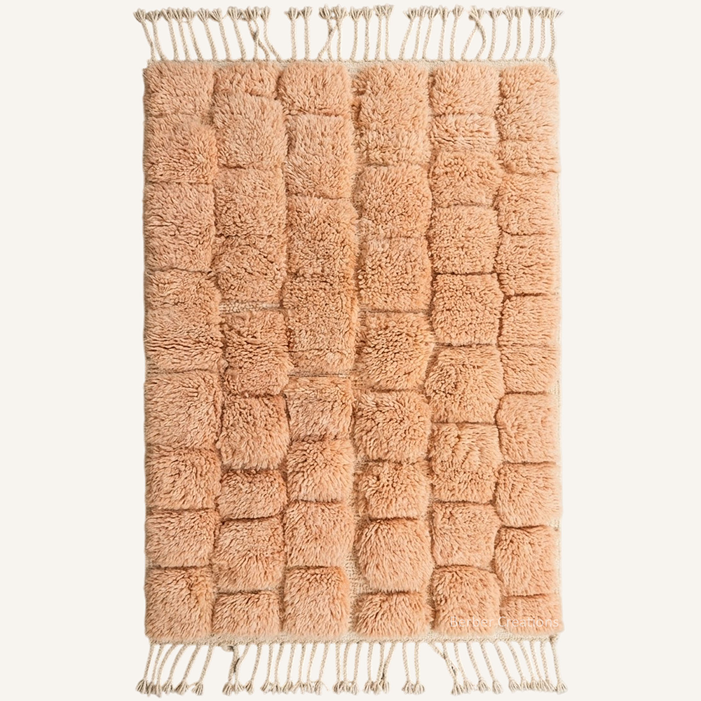 Raya sculptural high-pile hand-knotted Beni Mrirt wool rug in Soft Peach with a bubble block pattern, crafted in the Berber Creations workshop.