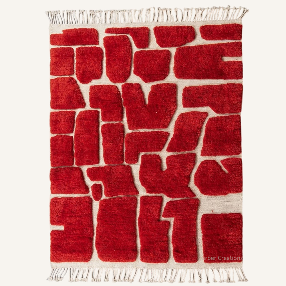 Safia abstract flagstone hand-knotted wool rug featuring a carved structural crazy paving pattern in Burgundy, crafted in the Berber Creations workshop.