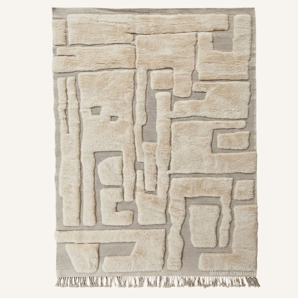 Abstract 3D high-low pile "Sculpted Labyrinth" Moroccan wool rug featuring raised geometric panels of cream over a taupe woven base, hand-knotted by Berber Creations.