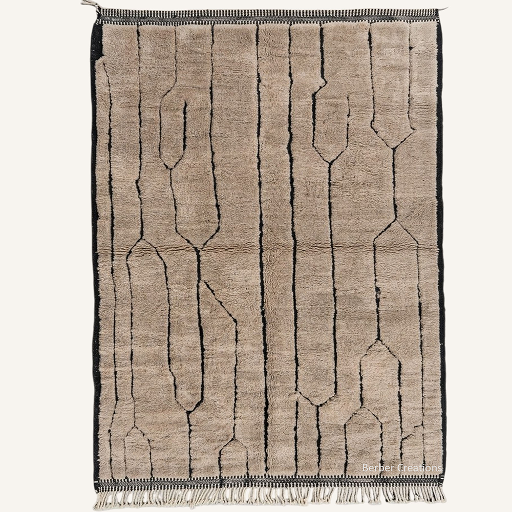 Abstract "Taupe Canyons" Moroccan wool rug with plush pile, featuring fine black geometric lines on a soft taupe background, hand-knotted by Berber Creations.