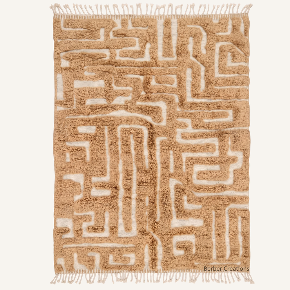 Abstract 3D high-low pile "Taza" Moroccan wool rug featuring raised geometric maze paths of amber over a cream background, hand-knotted by Berber Creations.