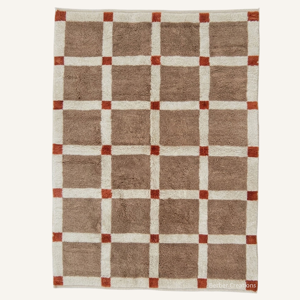 Geometric "Terracotta Grid" Moroccan wool rug with plush mocha and cream pile, featuring burnt orange accent squares, hand-knotted by Berber Creations.
