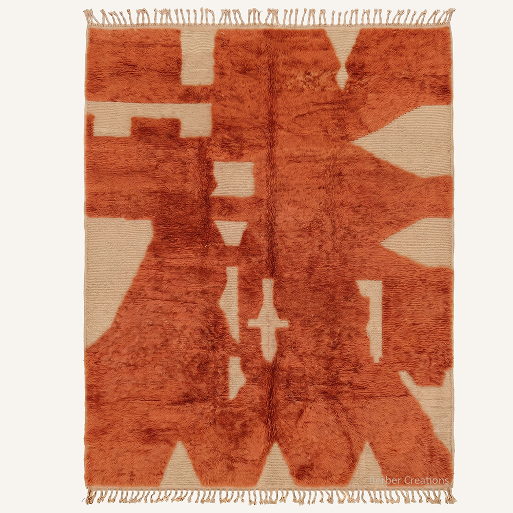 Zora deconstructed cubist hand-knotted Beni Mrirt wool rug featuring an abstract jagged Rust Orange pattern over a cream base, crafted in the Berber Creations workshop.