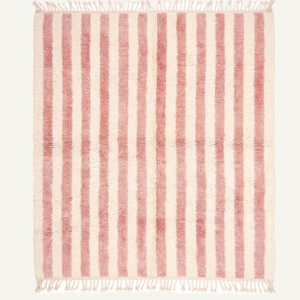 handmade Moroccan Berber wool rug featuring alternating dusty pink and natural cream vertical stripes