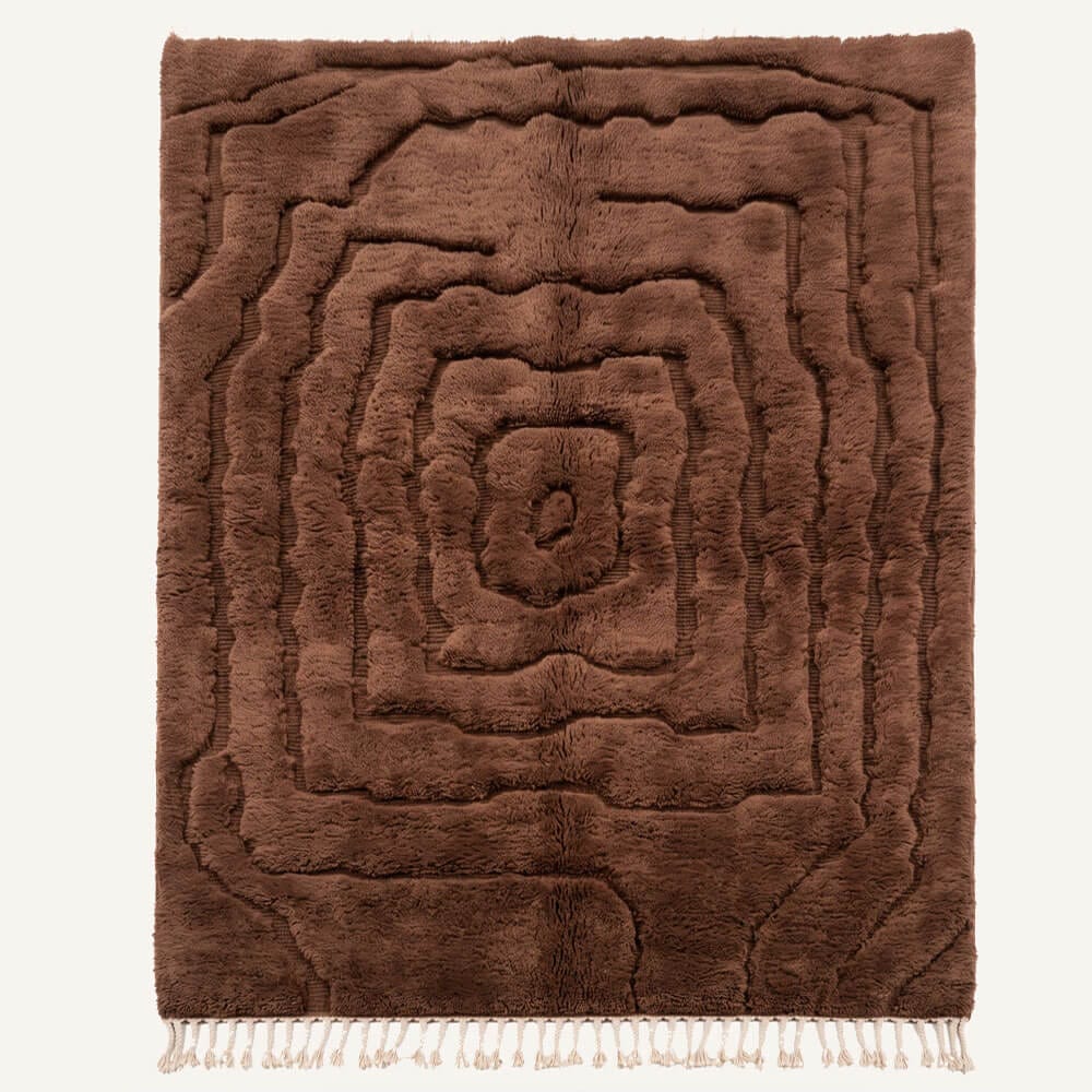 Igherm handmade Moroccan Berber wool rug featuring a deep chocolate brown monochromatic design with concentric wavy carved geometric rings and braided natural cream fringe.