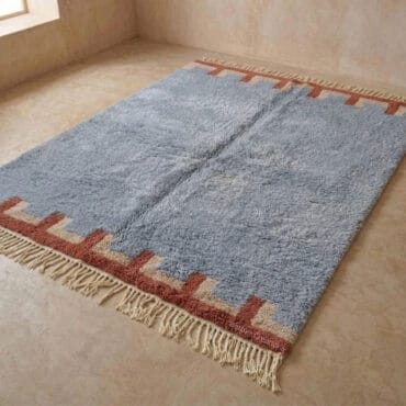 The Anir Rug – Handmade Slate Blue Moroccan Berber Rug with Terracotta Crenellated Border