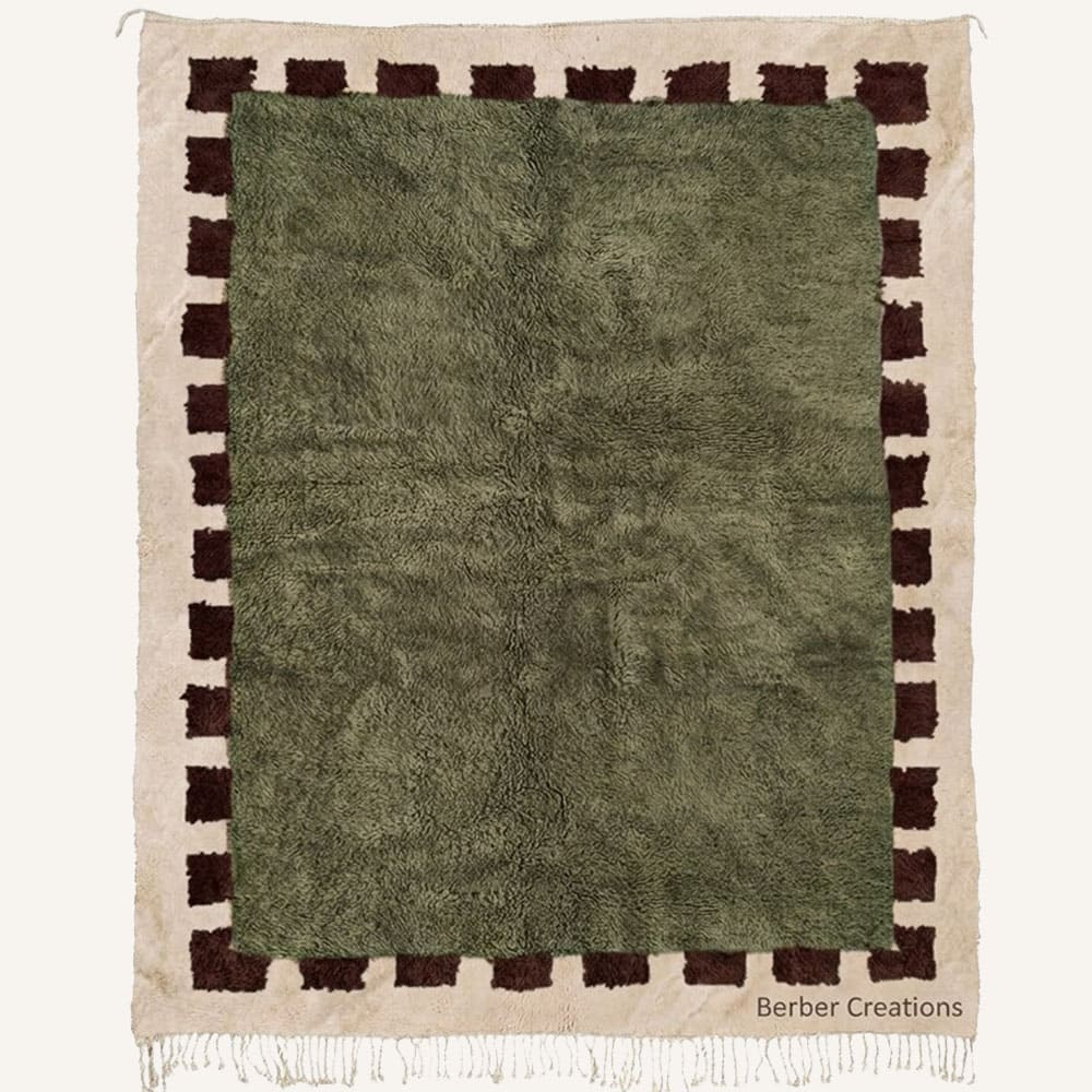Azegzaw handmade Moroccan Berber wool rug featuring a lush olive green center framed by a dark brown checkered tooth border on a natural cream base with braided fringe.